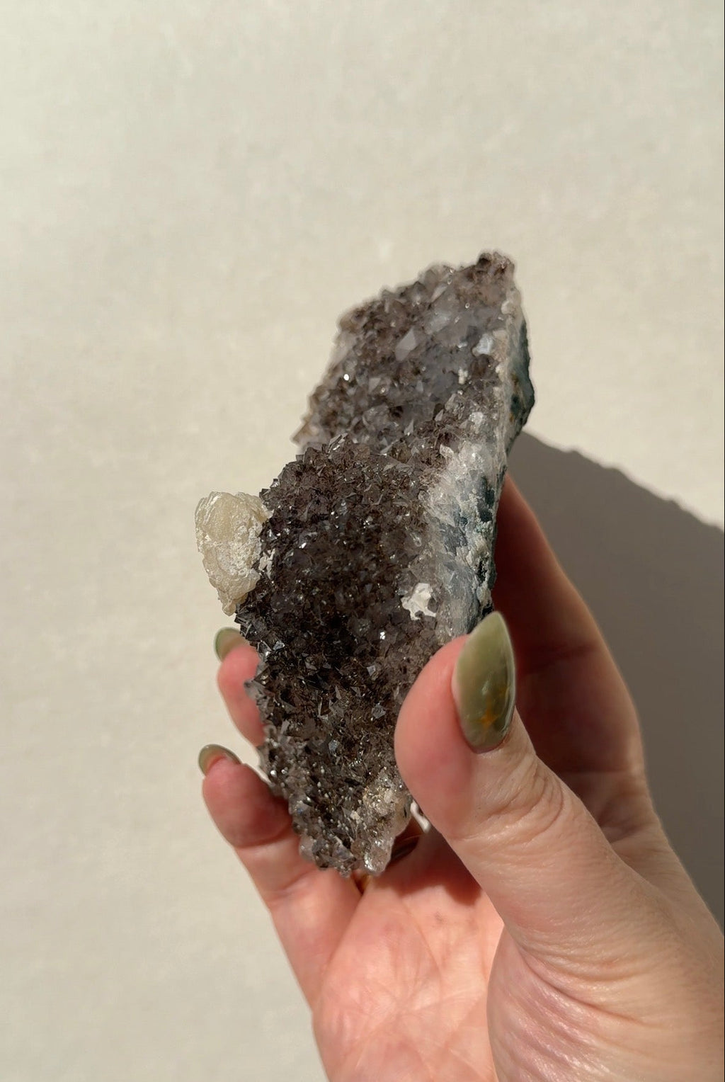 Rainbow Amethyst on stand with Calcite