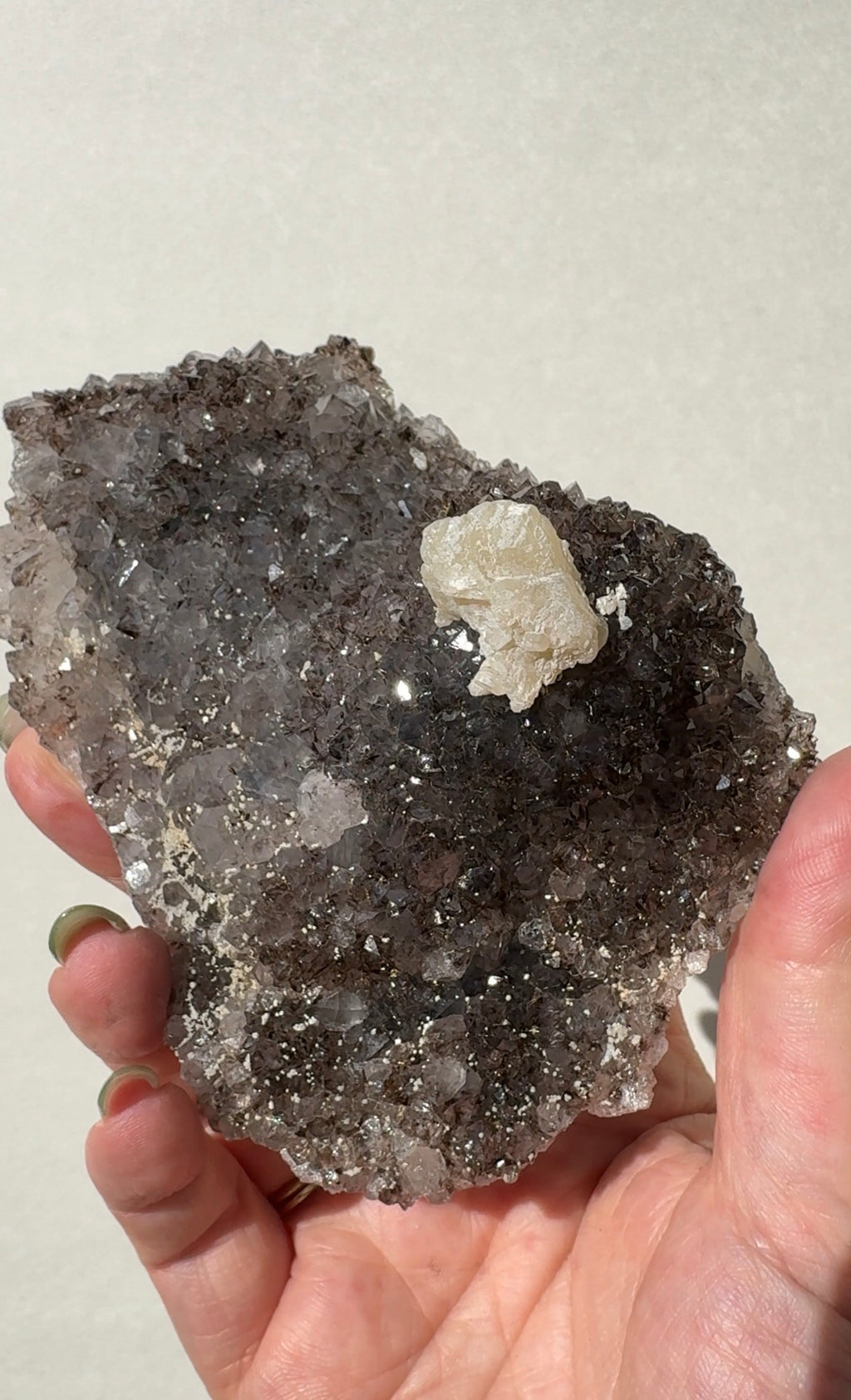 Rainbow Amethyst on stand with Calcite