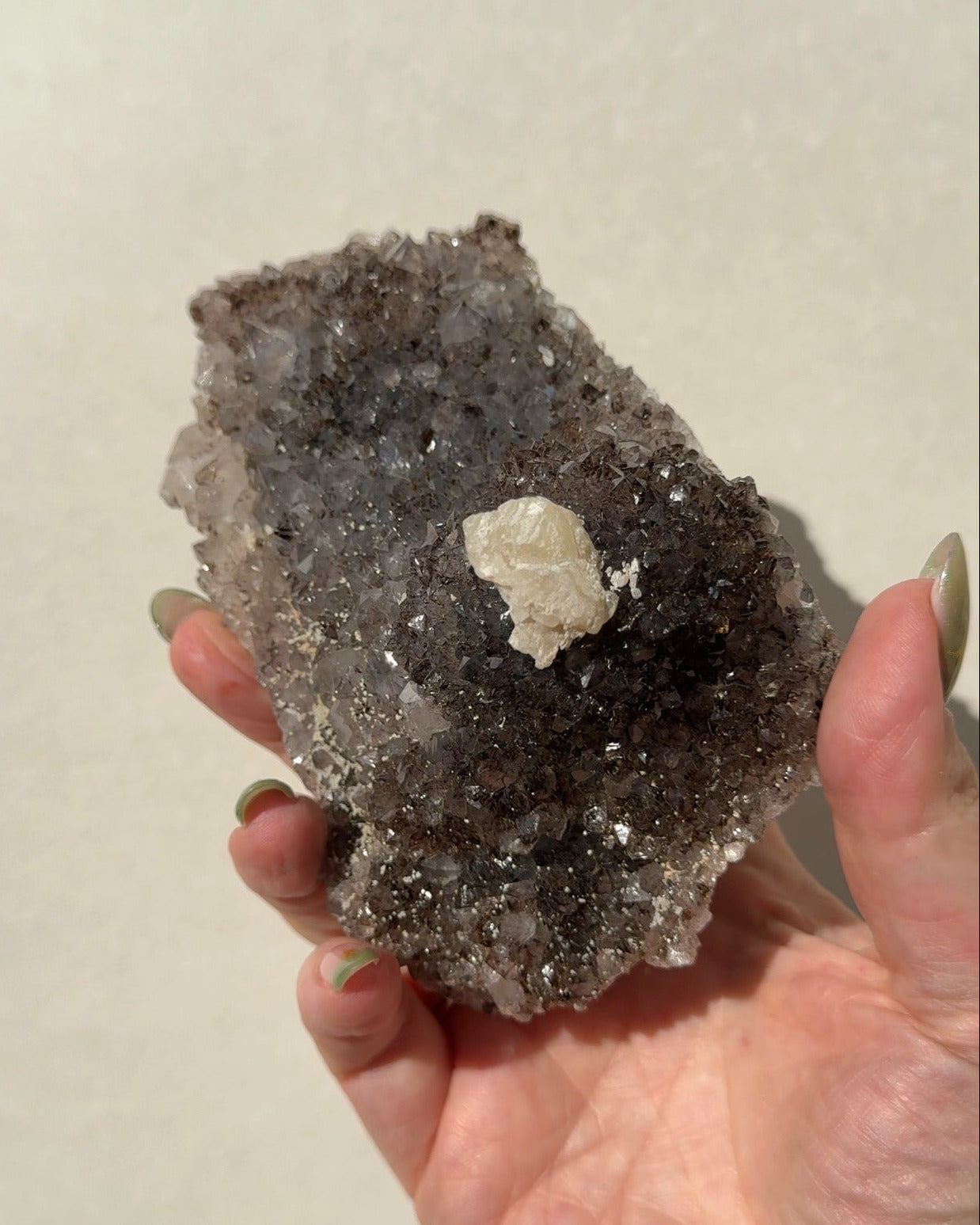 Rainbow Amethyst on stand with Calcite