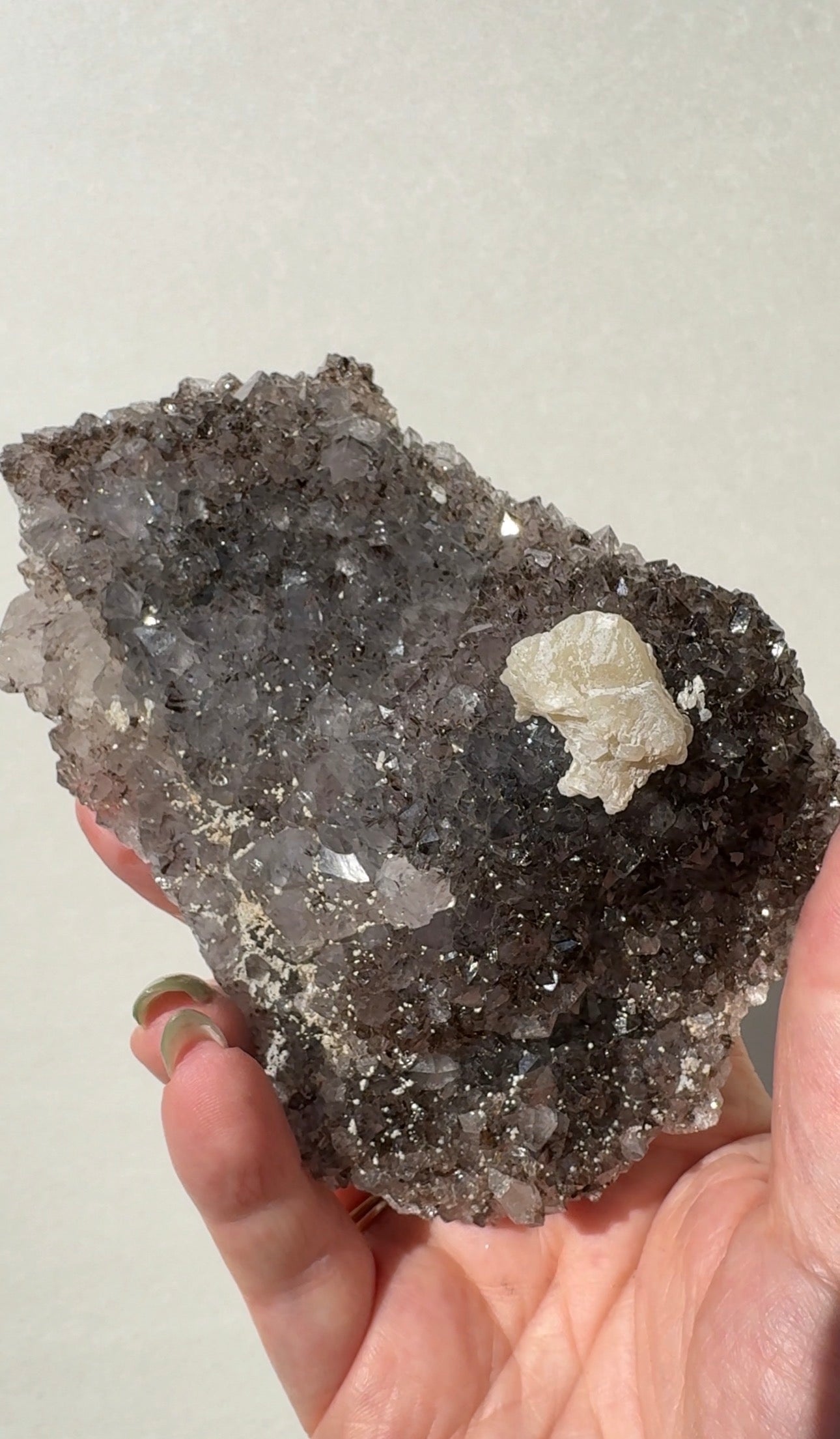 Rainbow Amethyst on stand with Calcite