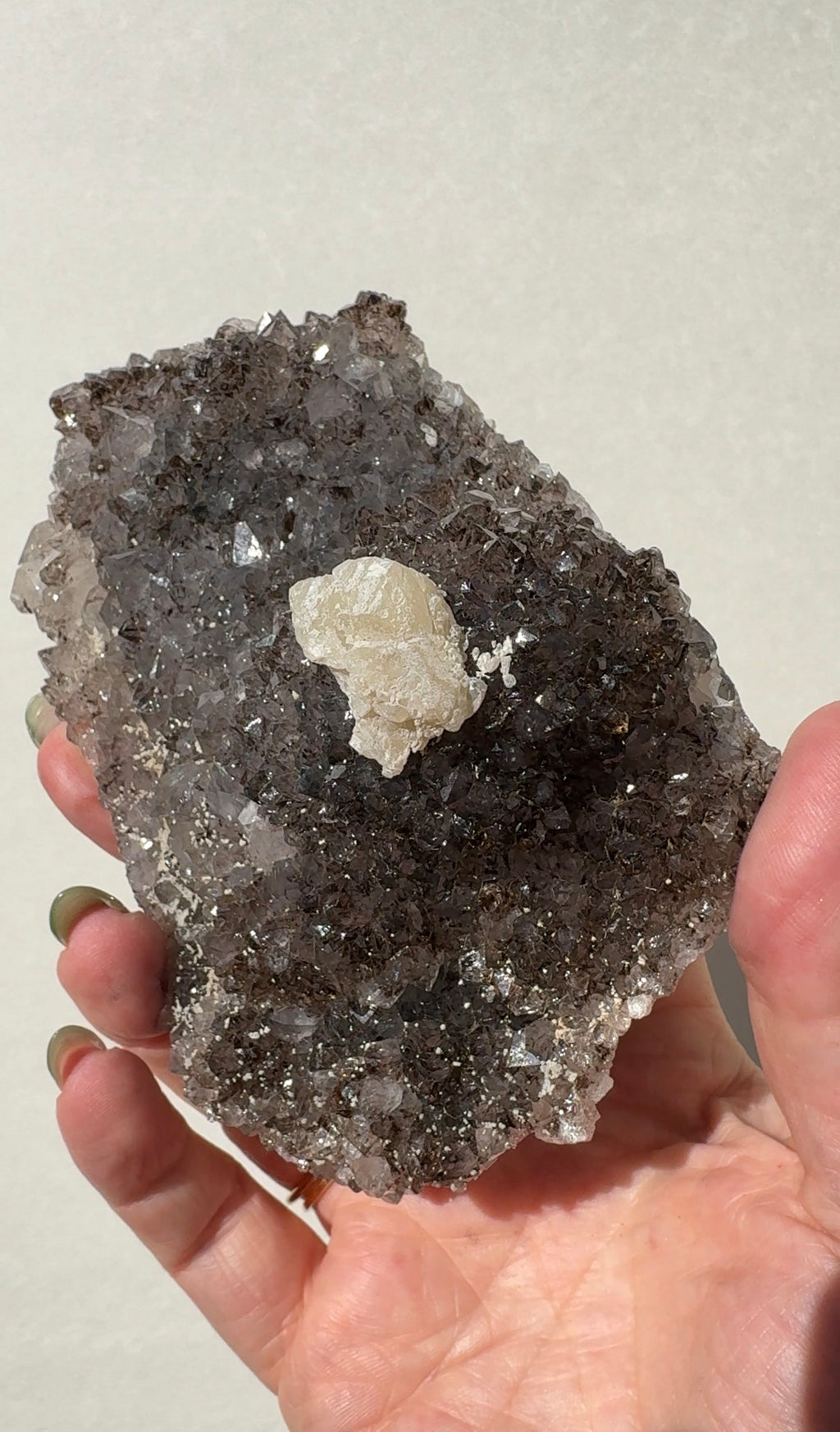 Rainbow Amethyst on stand with Calcite