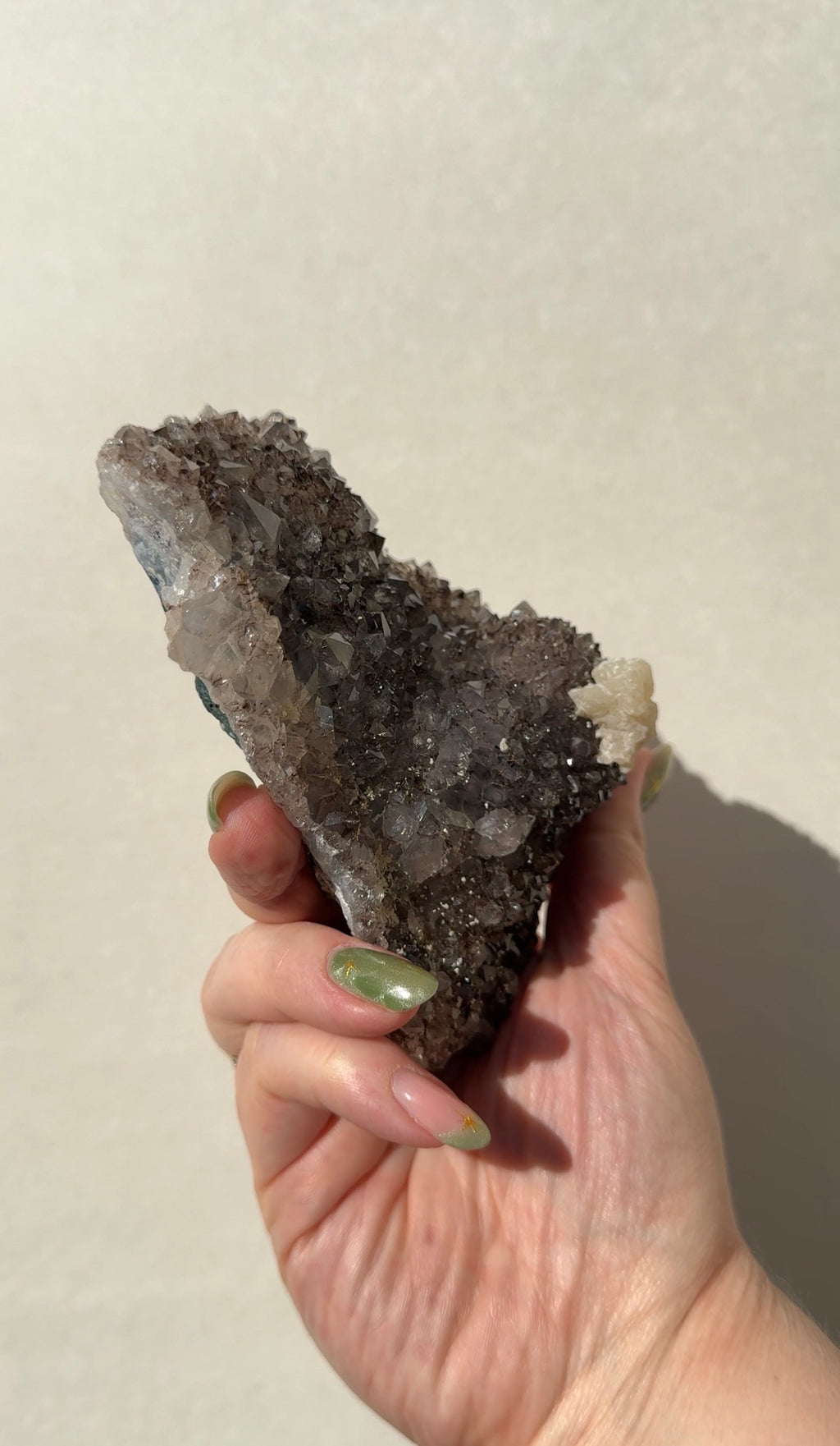 Rainbow Amethyst on stand with Calcite