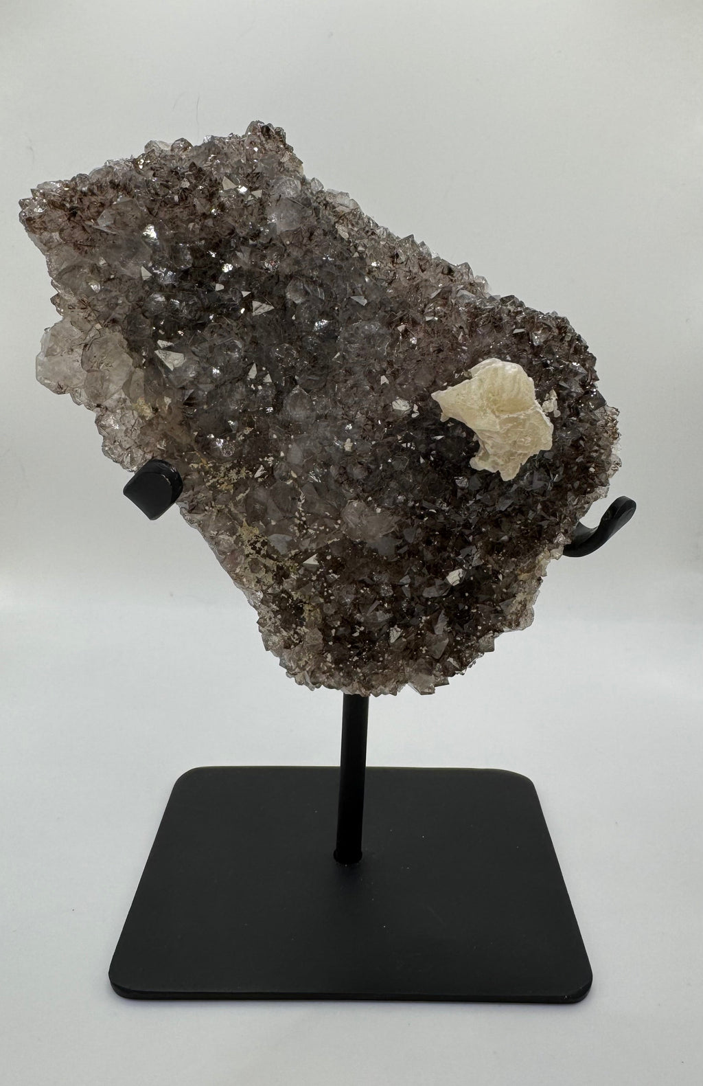 Rainbow Amethyst on stand with Calcite