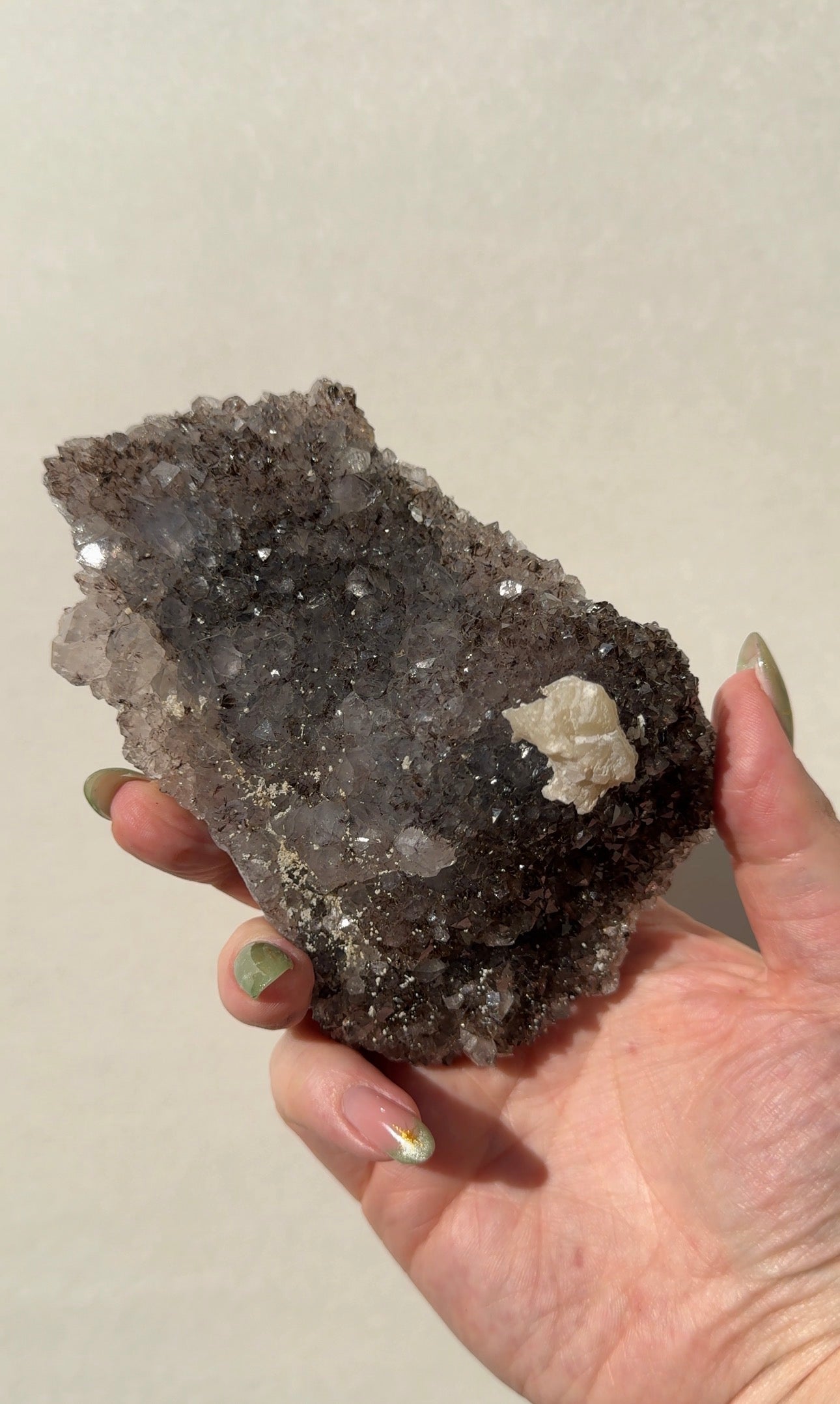 Rainbow Amethyst on stand with Calcite