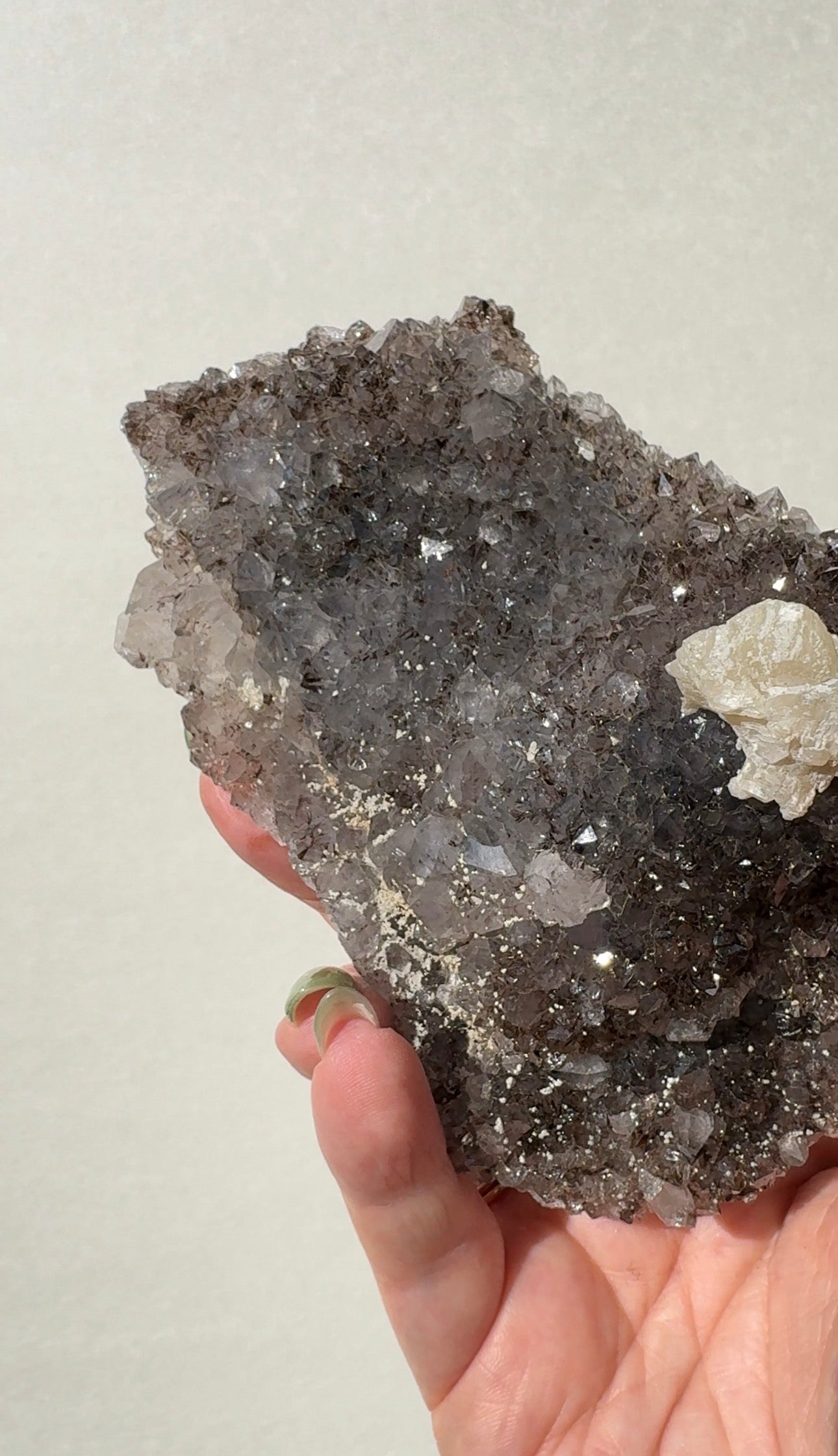 Rainbow Amethyst on stand with Calcite