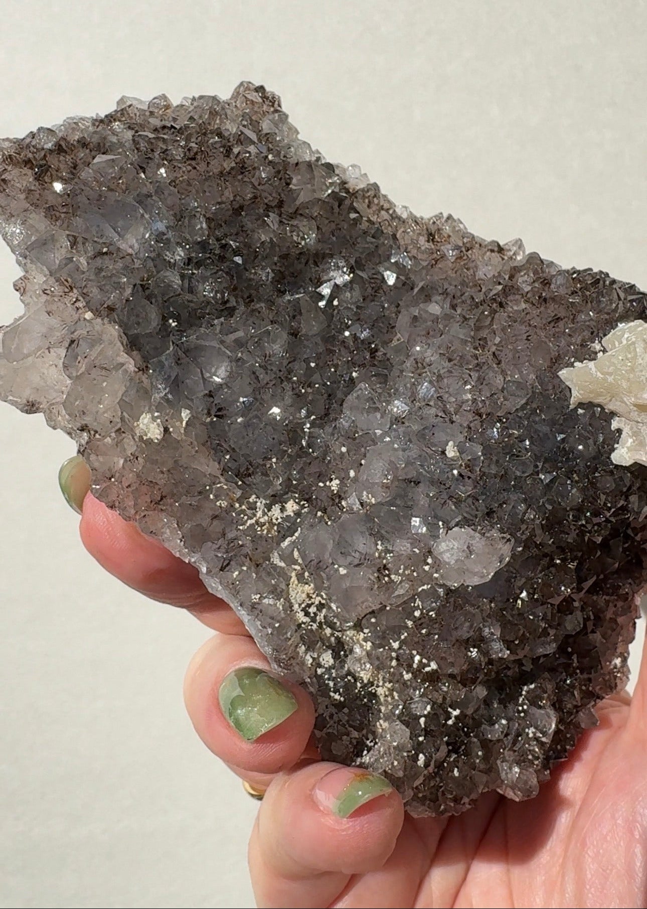 Rainbow Amethyst on stand with Calcite